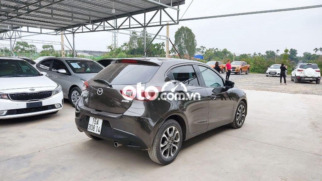 Mazda 2   1.5 AT 2016 - Cần bán Mazda 2 1.5 AT năm sản xuất 2016, màu nâu, 385 triệu