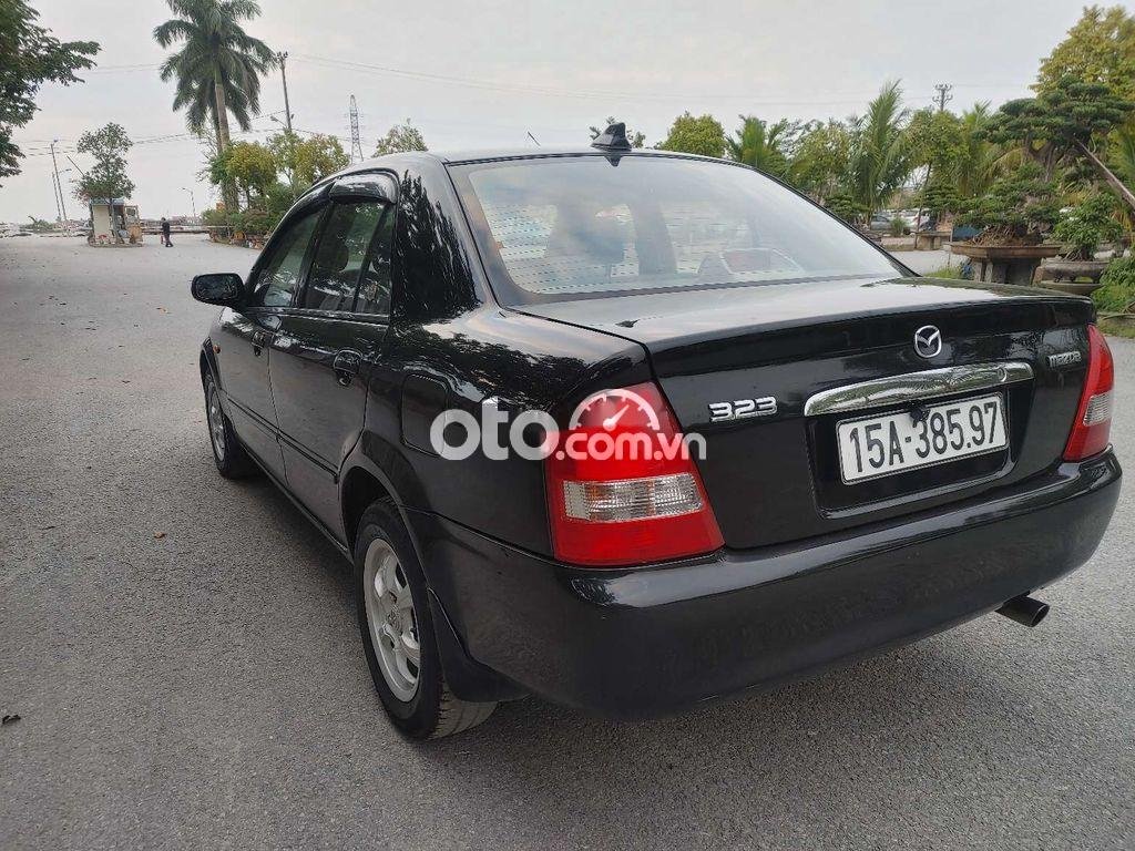 Mazda 323 2004 - Cần bán lại xe Mazda 323 sản xuất năm 2004, màu đen, giá 150tr