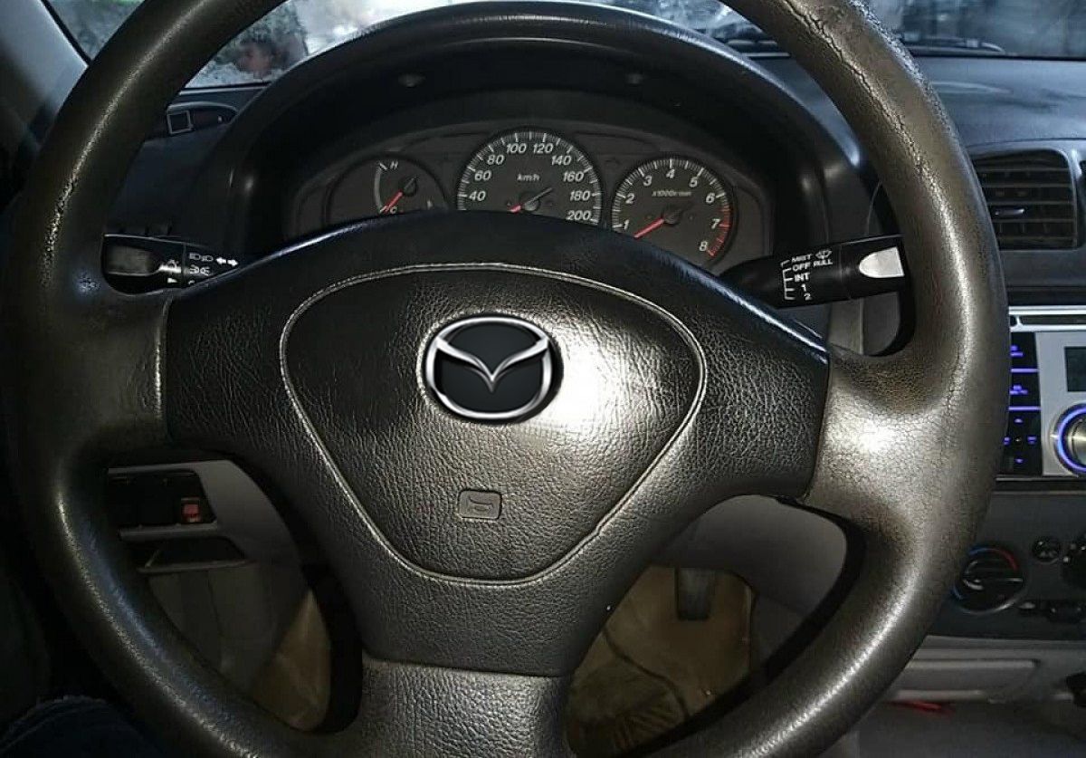 Mazda 323     2002 - Cần bán Mazda 323 năm sản xuất 2002, màu xanh lam, giá 132tr