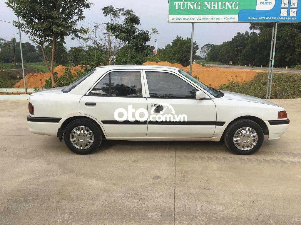 Mazda 323 1997 - Cần bán lại xe Mazda 323 đời 1997, màu trắng, xe nhập  