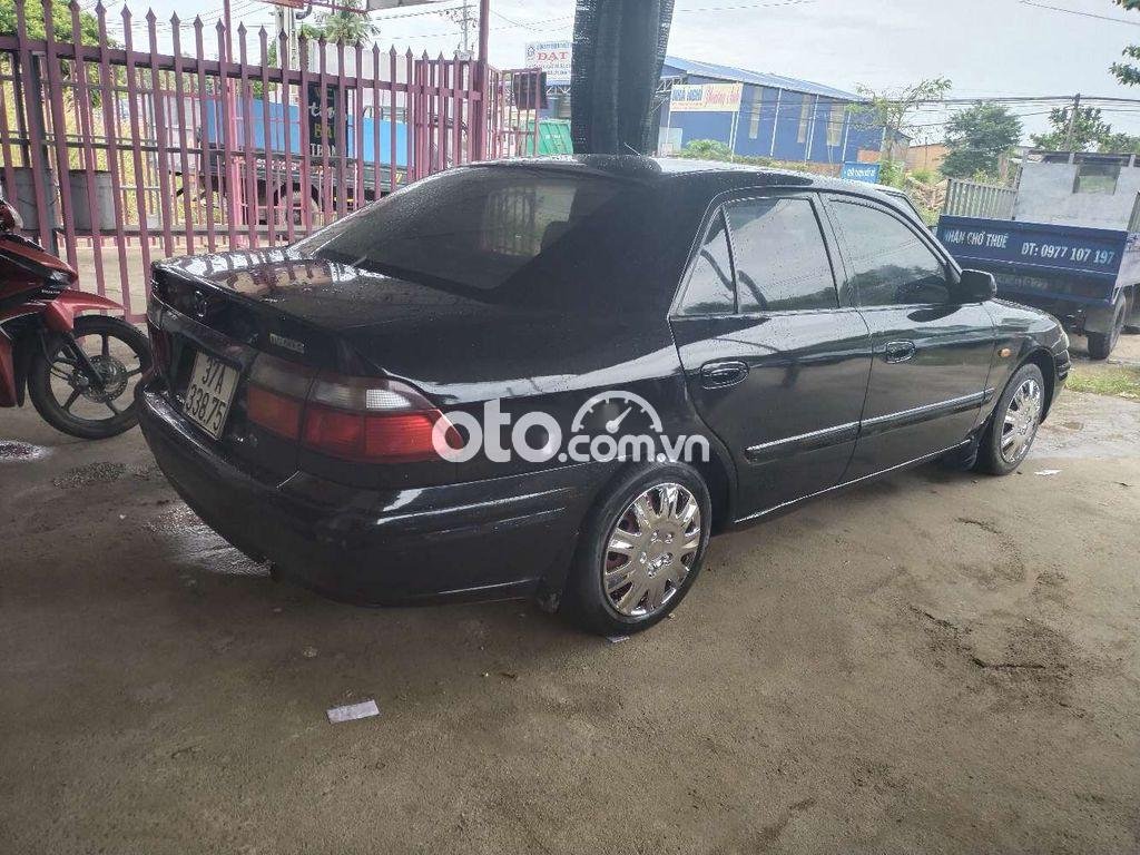 Mazda 626 1999 - Bán xe Mazda 626 năm sản xuất 1999, màu đen, nhập khẩu xe gia đình