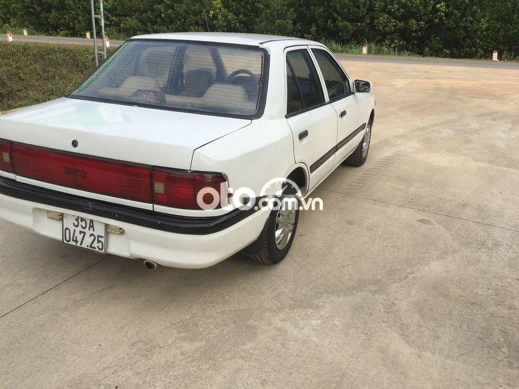 Mazda 323 1997 - Cần bán lại xe Mazda 323 đời 1997, màu trắng, xe nhập  