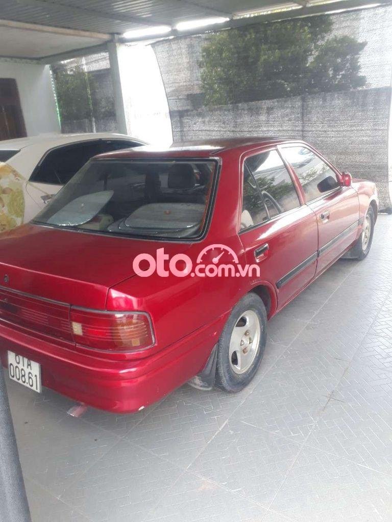 Mazda 323    1992 - Cần bán gấp Mazda 323 2.0MT năm sản xuất 1992, màu đỏ, xe nhập