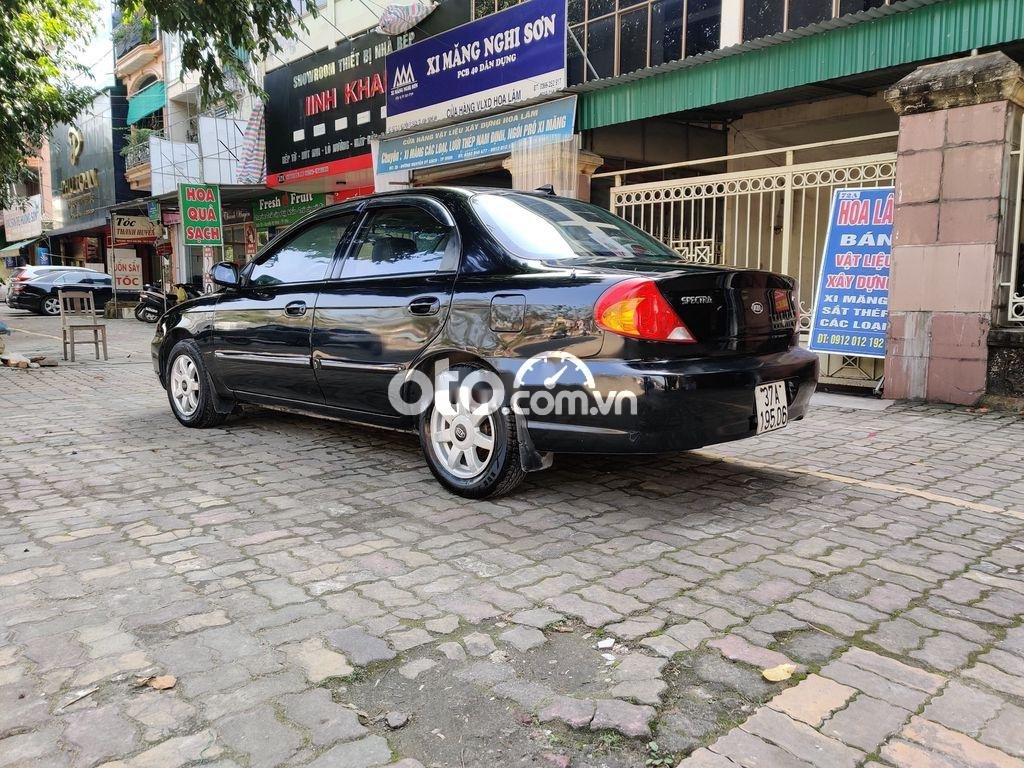 Kia Spectra MT 2004 - Cần bán Kia Spectra MT đời 2004, màu đen, giá chỉ 87 triệu