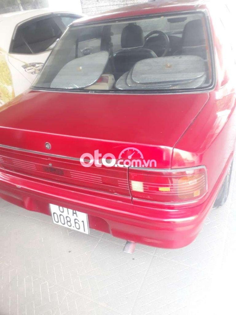 Mazda 323    1992 - Cần bán gấp Mazda 323 2.0MT năm sản xuất 1992, màu đỏ, xe nhập