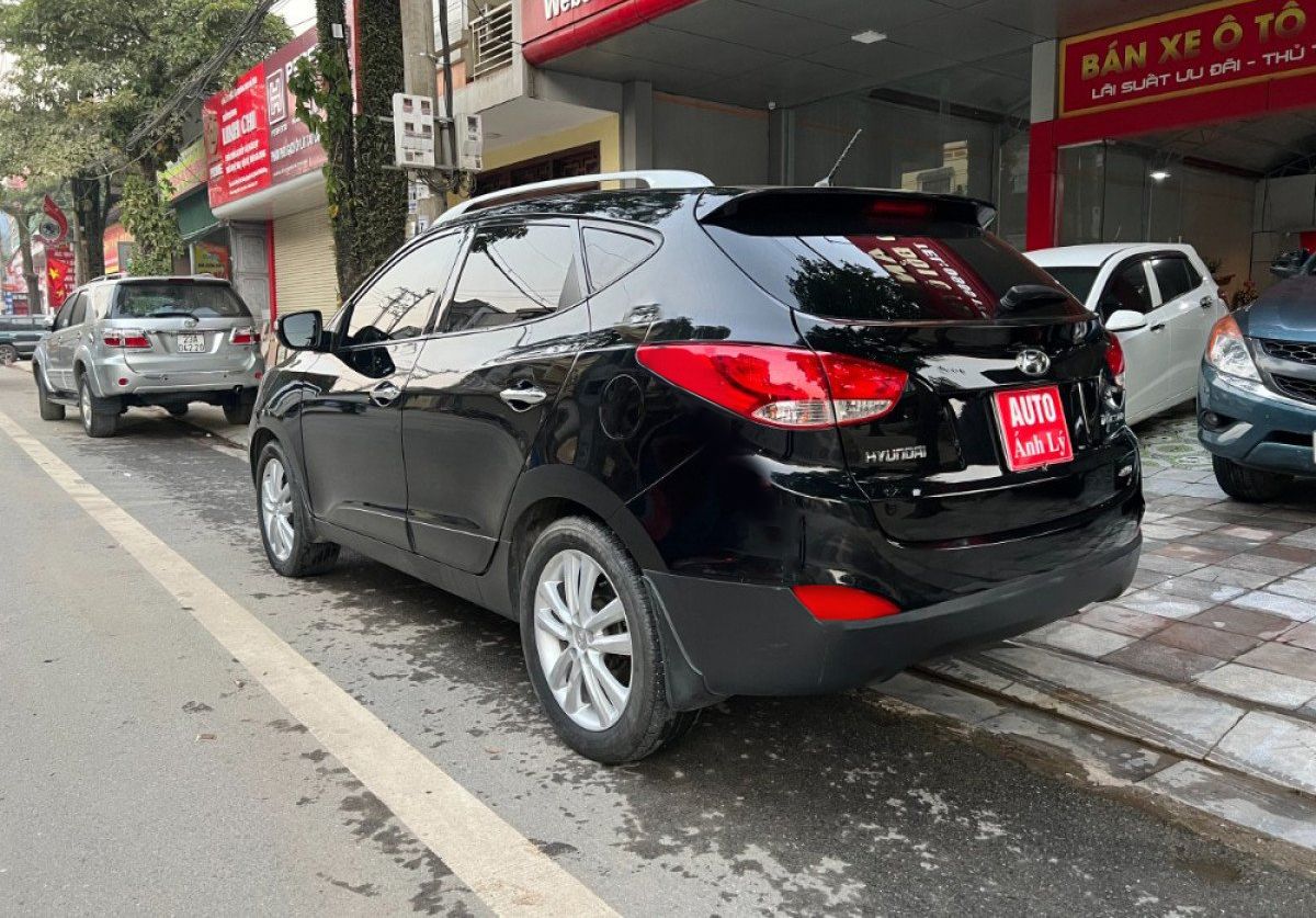 Hyundai Tucson   2.0 AT 4WD  2011 - Cần bán Hyundai Tucson 2.0 AT 4WD năm 2011, màu đen, nhập khẩu nguyên chiếc