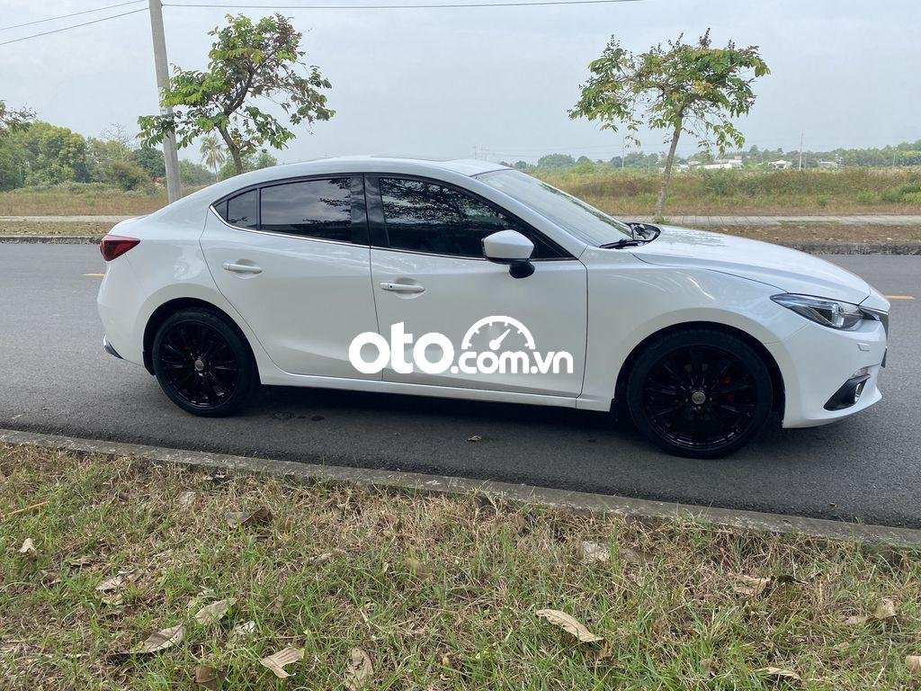 Mazda 3 AT 2015 - Cần bán gấp Mazda 3 AT năm 2015, màu trắng ít sử dụng