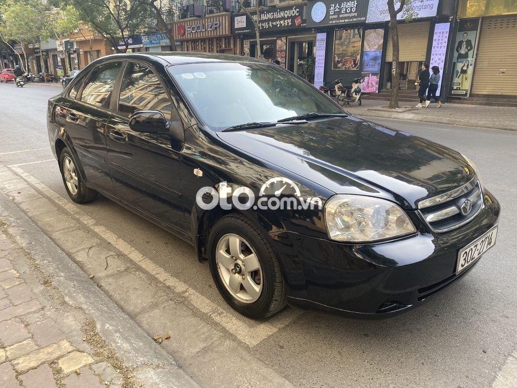 Daewoo Lacetti   EX 2010 - Cần bán Daewoo Lacetti EX sản xuất năm 2010, màu đen số sàn, giá 150tr