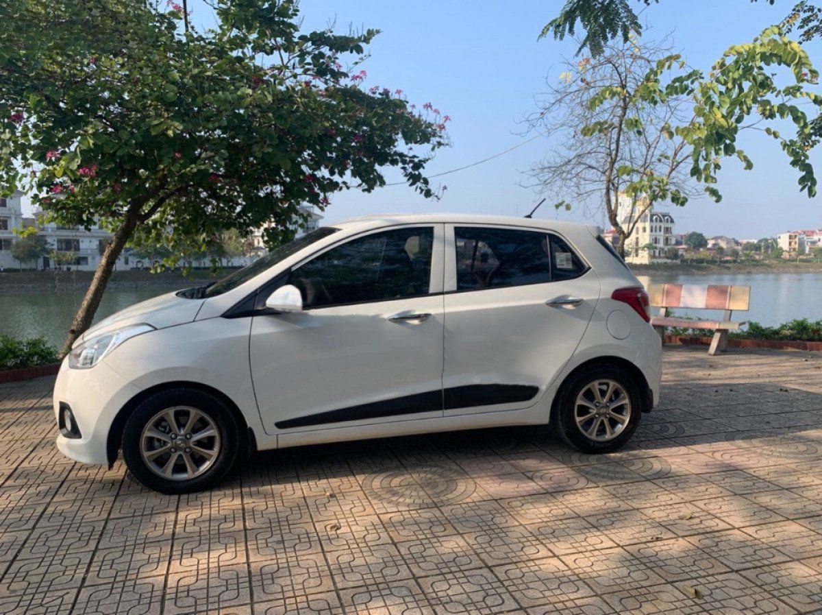 Hyundai Premio   1.2 AT   2015 - Bán xe Hyundai Grand i10 1.2 AT sản xuất năm 2015, màu trắng, nhập khẩu nguyên chiếc còn mới