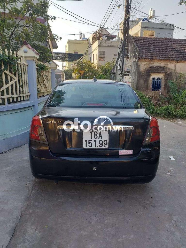 Daewoo Lacetti MT 2005 - Cần bán xe Daewoo Lacetti MT sản xuất 2005, màu đen