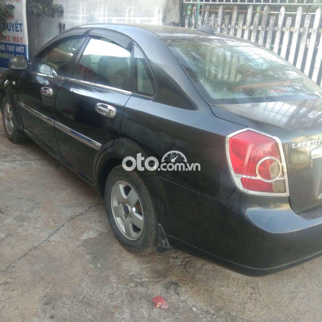 Daewoo Lacetti MT 2005 - Cần bán xe Daewoo Lacetti MT sản xuất 2005, màu đen