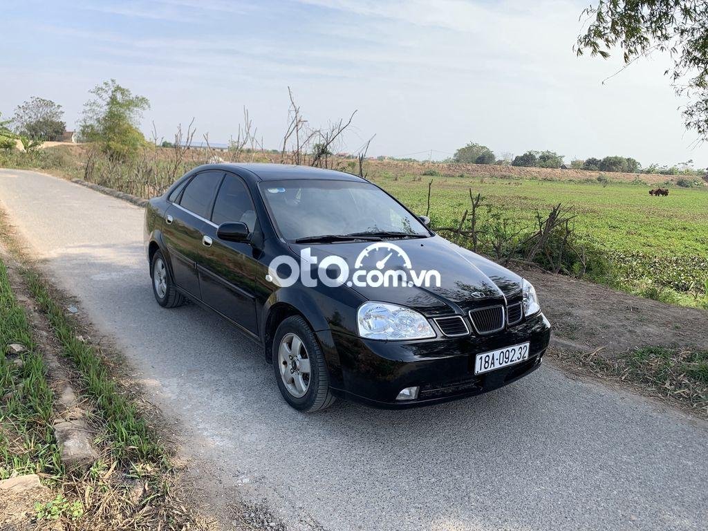 Daewoo Lacetti MT 2005 - Cần bán Daewoo Lacetti MT 2005, màu đen, nhập khẩu  