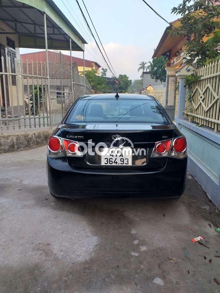 Daewoo Lacetti CDX 2009 - Cần bán Daewoo Lacetti CDX sản xuất 2009, màu đen, nhập khẩu