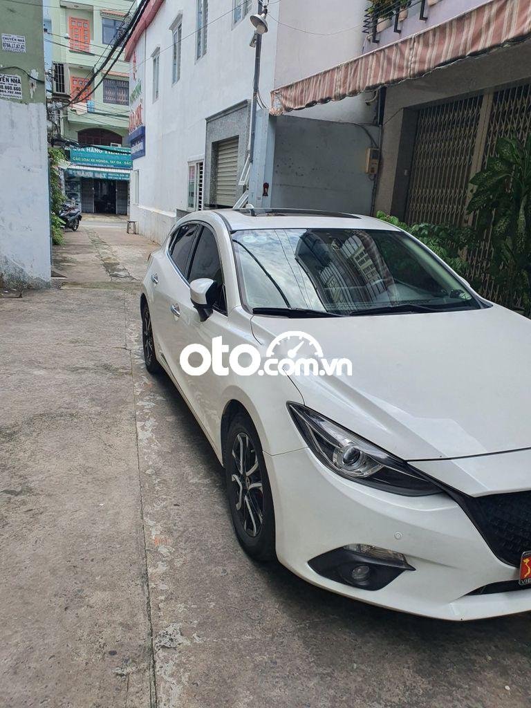 Mazda 3  1.5AT  2016 - Cần bán lại xe Mazda 3 1.5AT năm sản xuất 2016, màu trắng