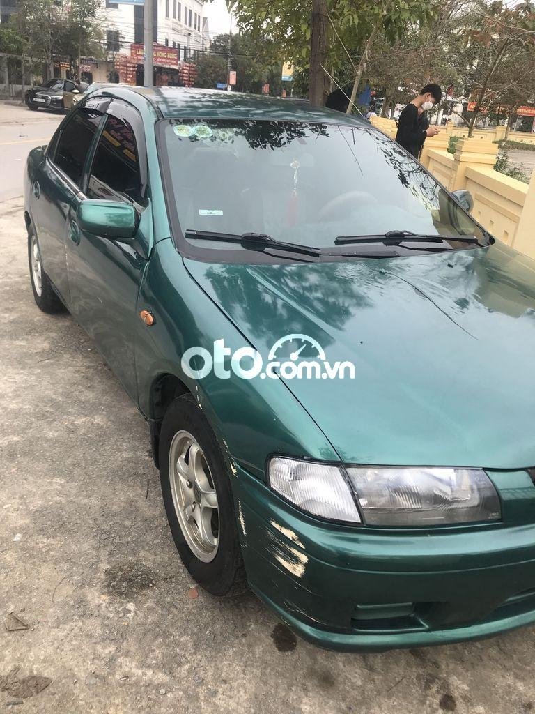 Mazda 323 1.6 MT 1999 - Bán Mazda 323 1.6 MT sản xuất 1999, màu xanh giá chỉ 62 triệu