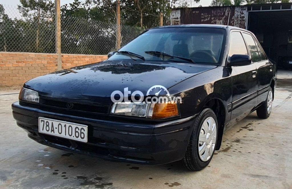 Mazda 323 MT 1994 - Cần bán xe Mazda 323 MT năm sản xuất 1994, màu đen, xe nhập, giá chỉ 39 triệu