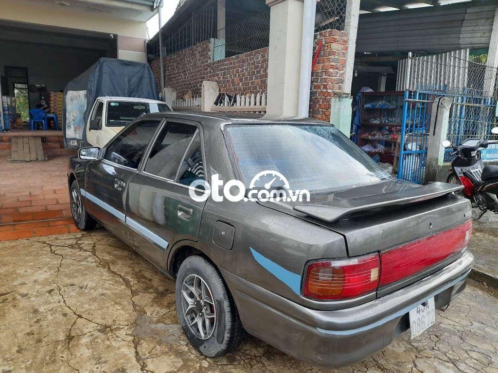 Mazda 323   2.0MT 1993 - Cần bán xe Mazda 323 2.0MT năm sản xuất 1993, màu xám, xe nhập