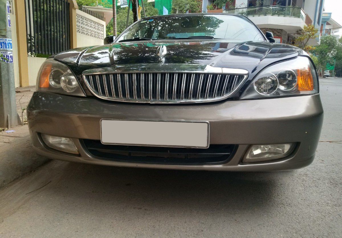 Daewoo Magnus 2004 - Cần bán xe Daewoo Magnus 2.0 sản xuất năm 2004, màu đen