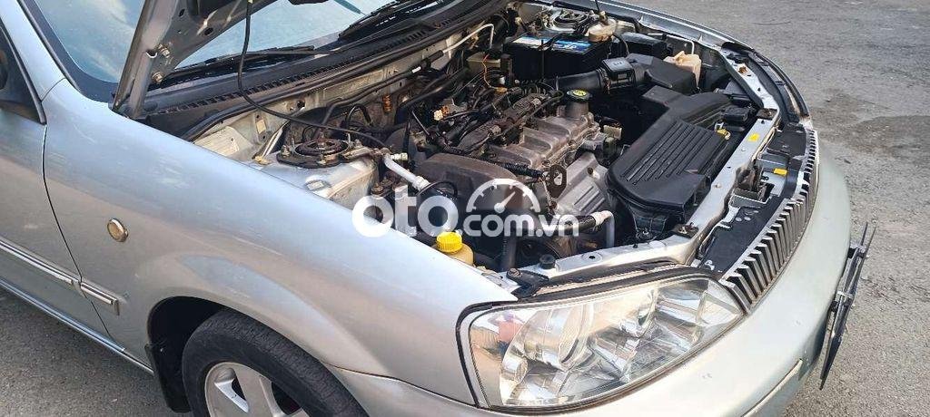 Ford Laser   Ghia 1.8 MT 2002 - Cần bán xe Ford Laser Ghia 1.8 MT sản xuất năm 2002, màu bạc 