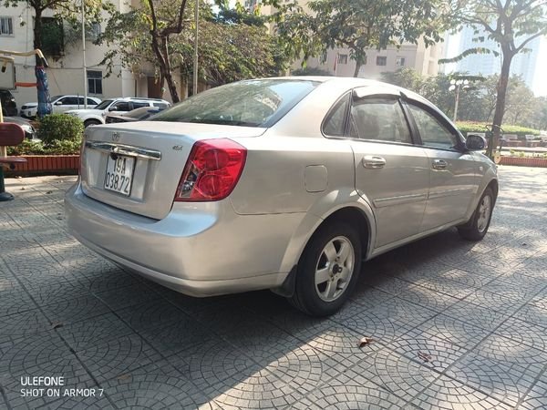 Daewoo Lacetti 2010 - Cần bán lại xe Daewoo Lacetti EX MT sản xuất 2010, màu bạc