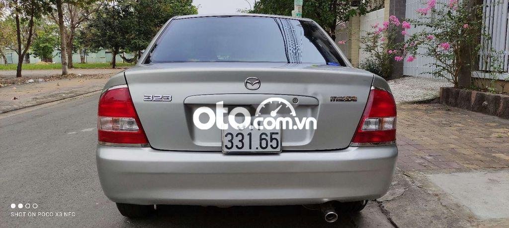 Mazda 323  MT 2002 - Cần bán xe Mazda 323 MT sản xuất 2002, màu bạc, nhập khẩu nguyên chiếc chính chủ