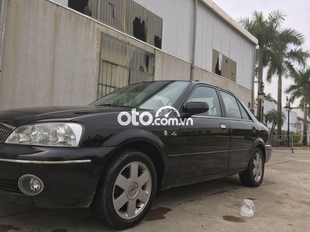 Ford Laser 2002 - Bán ô tô Ford Laser 1.6AT năm 2002, màu đen, 104tr