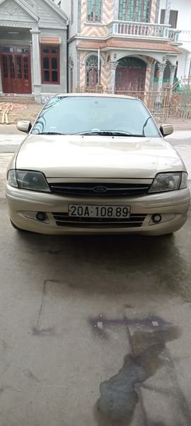 Ford Laser 2000 - Cần bán xe Ford Laser 1.6 năm 2000, màu vàng cát