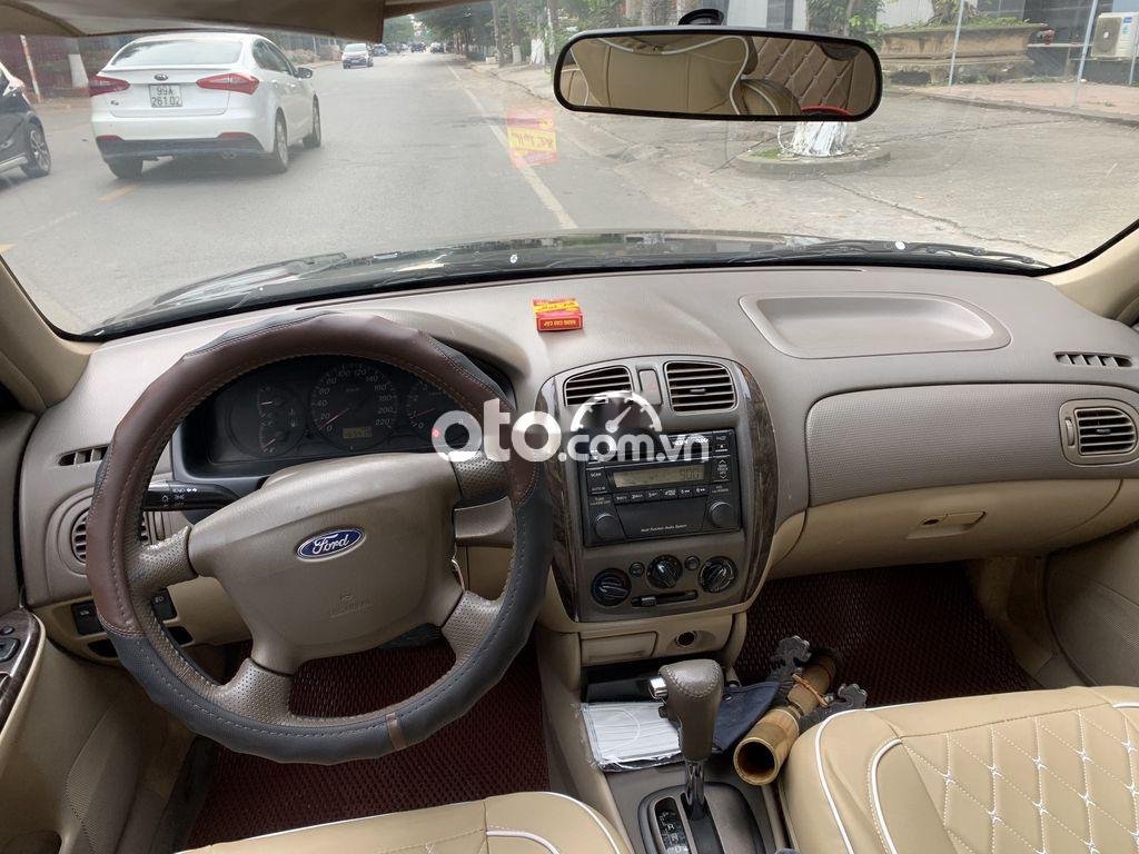 Ford Laser  1.6AT 2004 - Cần bán Ford Laser 1.6AT năm 2004, màu đen, 160 triệu