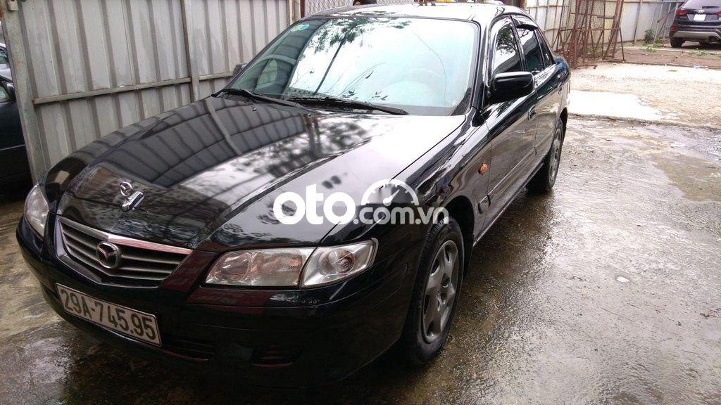 Mazda 626 MT 2001 - Cần bán lại xe Mazda 626 MT sản xuất năm 2001, màu đen