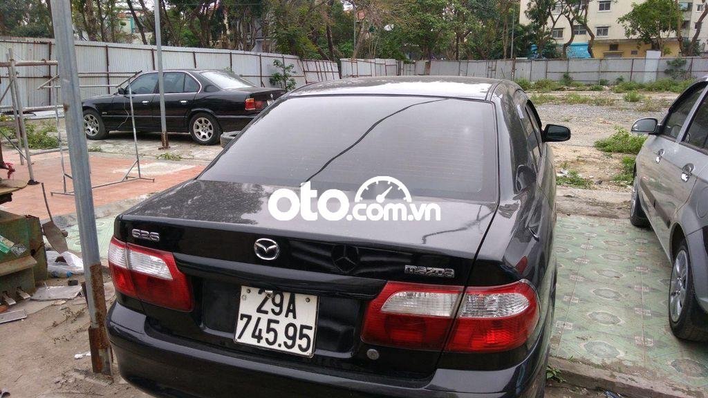 Mazda 626 MT 2001 - Cần bán lại xe Mazda 626 MT sản xuất năm 2001, màu đen