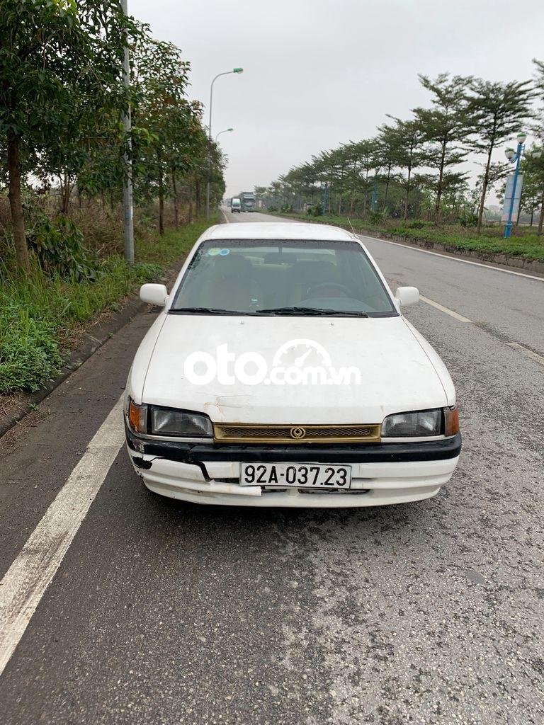 Mazda 323 1994 - Xe Mazda 323 2.0MT sản xuất năm 1994, màu trắng, xe nhập