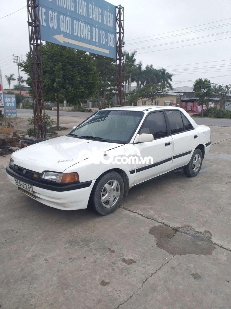 Mazda 323 1995 - Cần bán xe Mazda 323 2.0MT sản xuất năm 1995, màu trắng, nhập khẩu