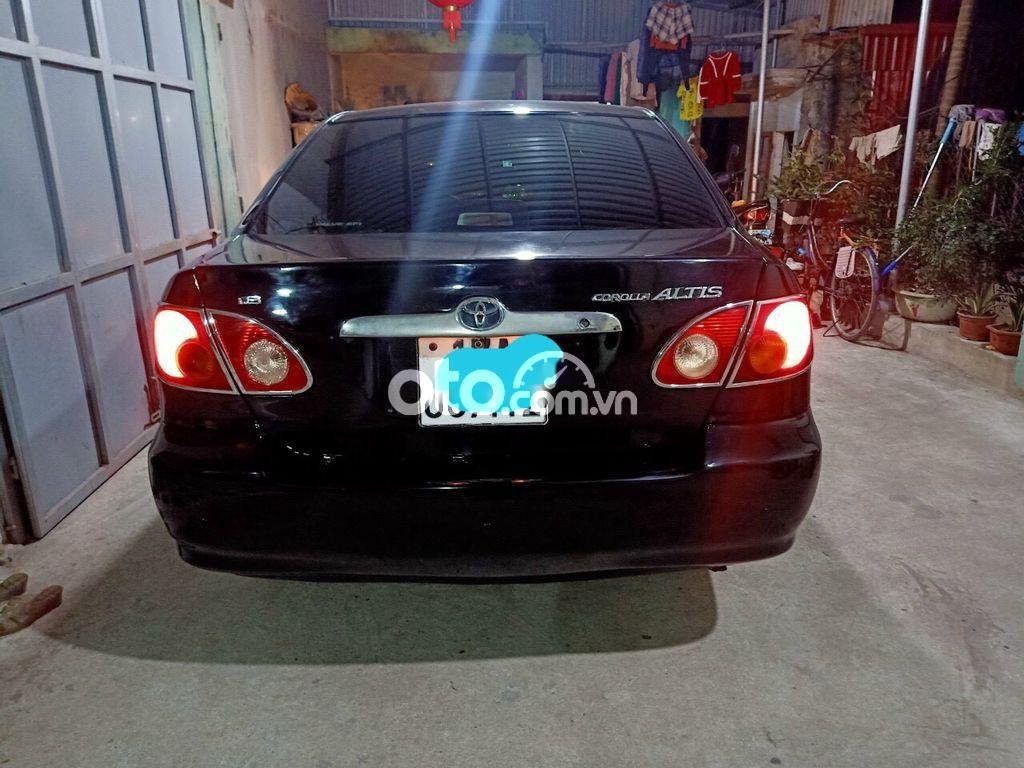 Toyota Corolla 1.8E MT 2004 - Cần bán Toyota Corolla 1.8E MT năm 2004, màu đen