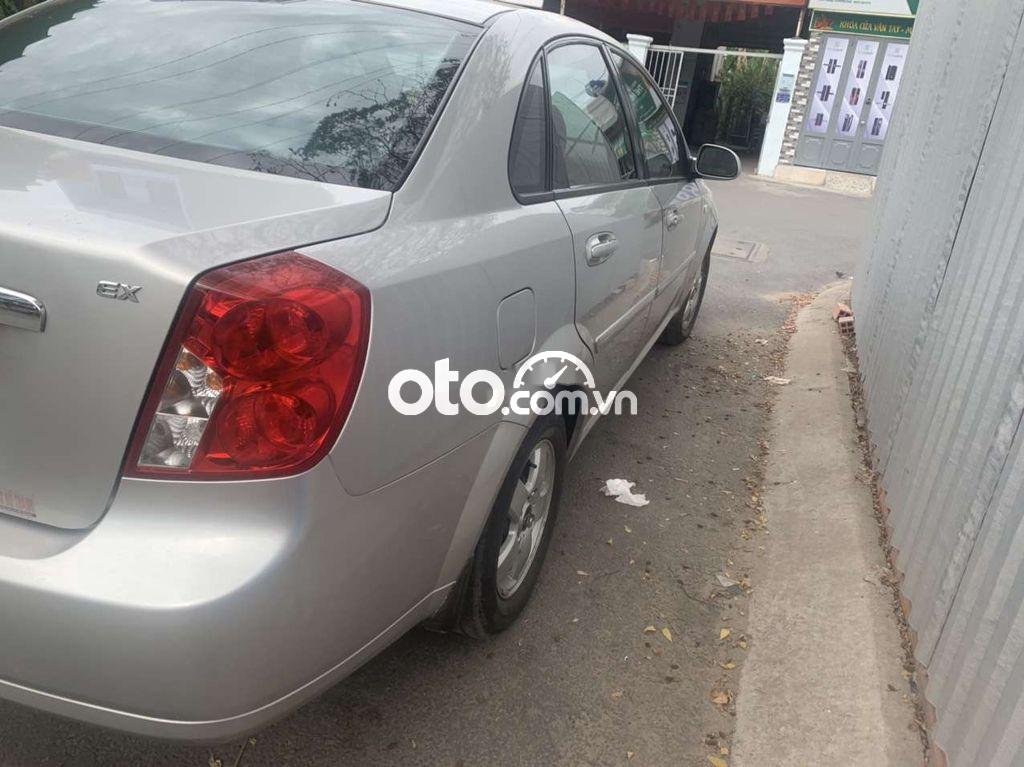 Chevrolet Lacetti  EX 1.6MT 2009 - Bán lại xe Chevrolet Lacetti EX 1.6MT sản xuất 2009, màu bạc xe gia đình