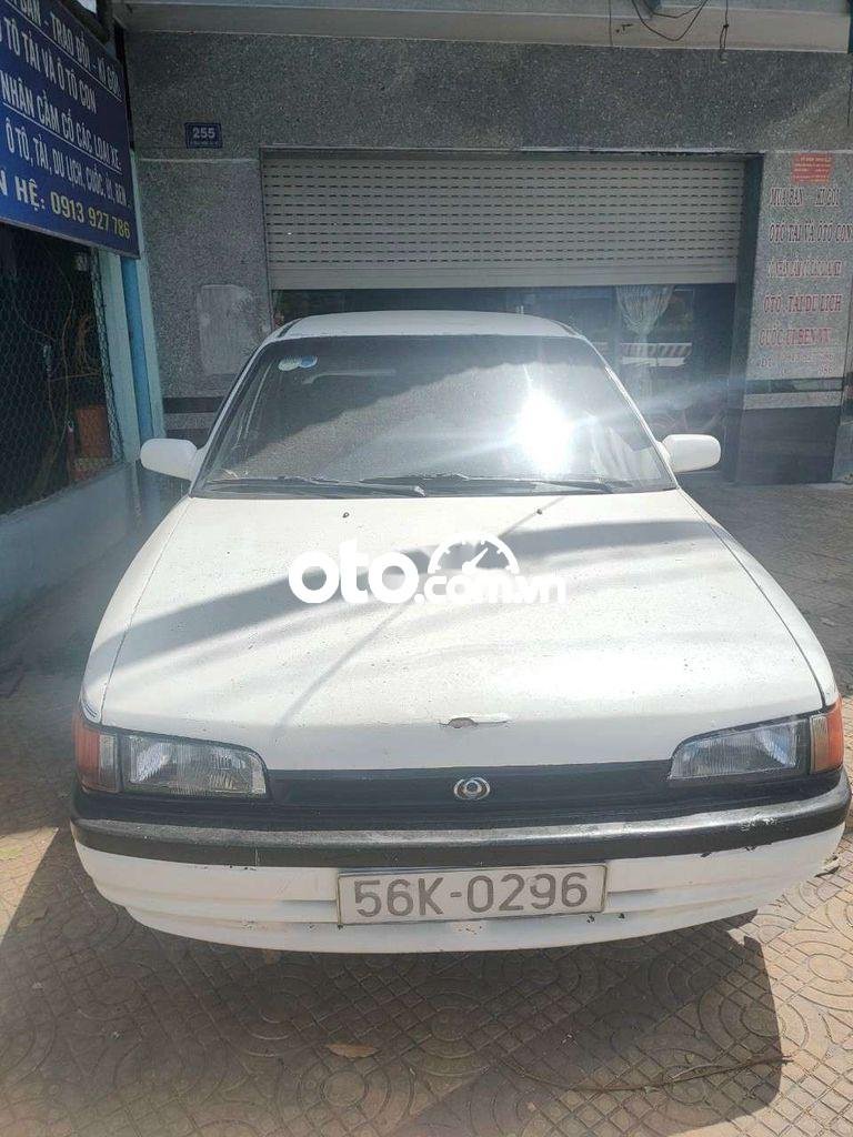 Mazda 323 1995 - Bán ô tô Mazda 323 sản xuất 1995, màu trắng, nhập khẩu