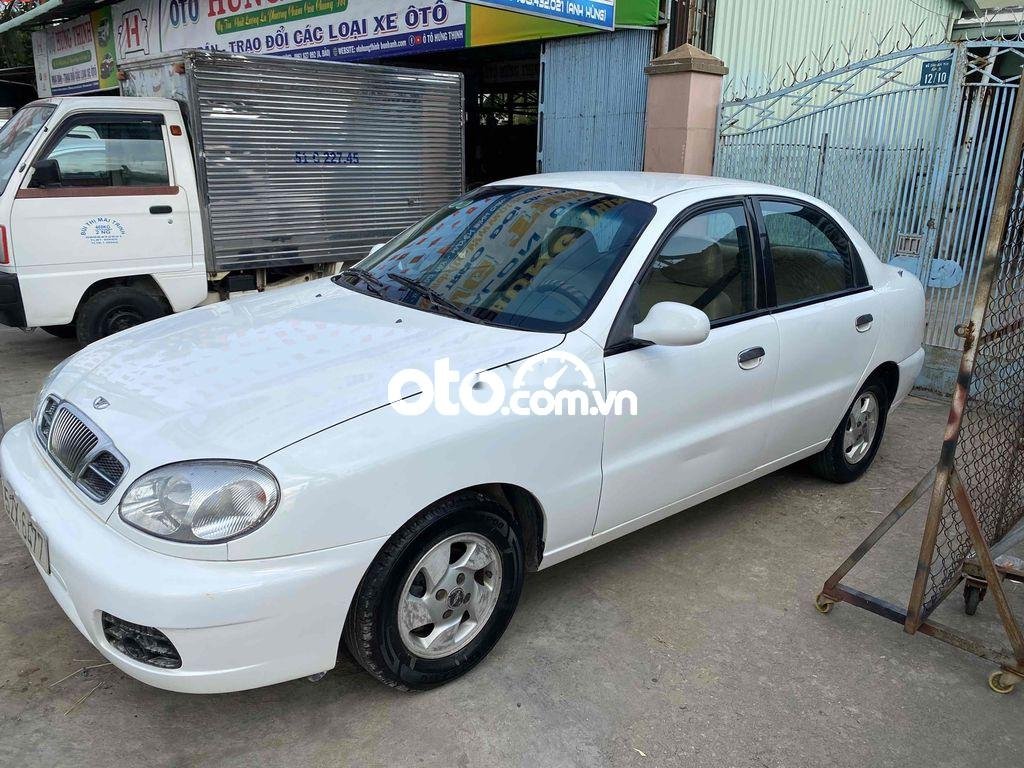 Daewoo Lanos 2004 - Cần bán Daewoo Lanos MT sản xuất năm 2004, màu trắng