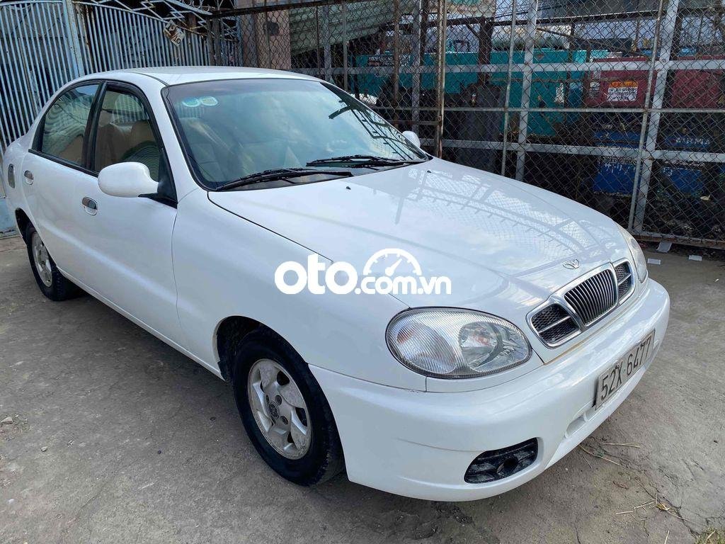 Daewoo Lanos 2004 - Cần bán Daewoo Lanos MT sản xuất năm 2004, màu trắng