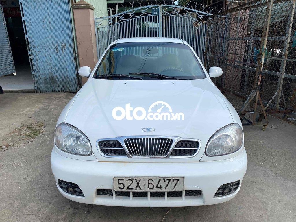 Daewoo Lanos 2004 - Cần bán Daewoo Lanos MT sản xuất năm 2004, màu trắng