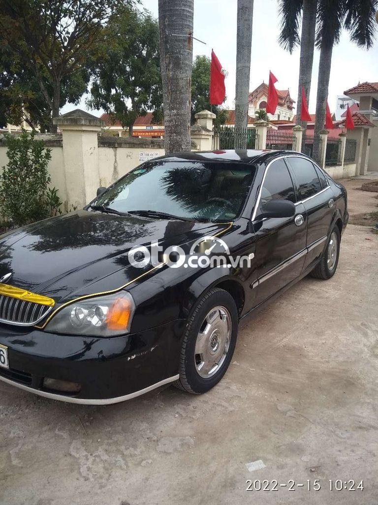 Daewoo Magnus 2004 - Bán Daewoo Magnus 2.0 năm 2004, màu đen số tự động