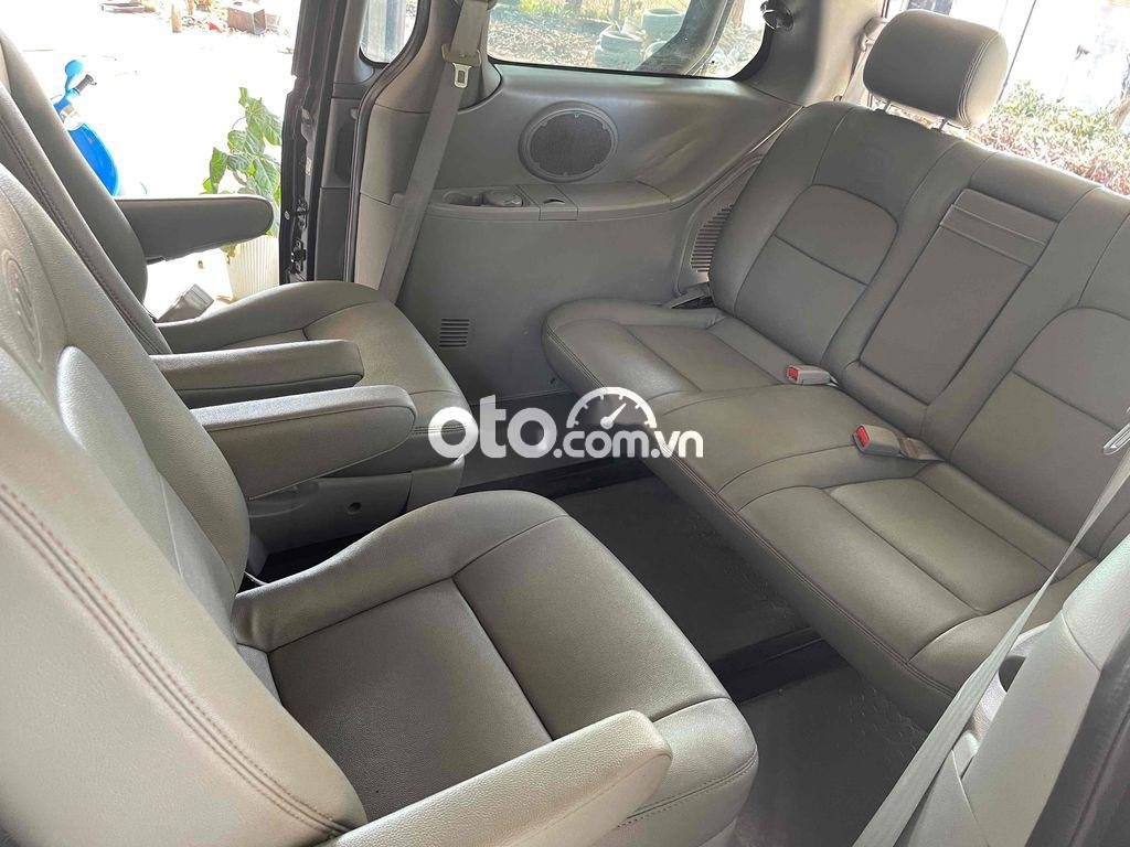 Kia Carnival 2009 - Cần bán lại xe Kia Carnival năm sản xuất 2009, màu đen