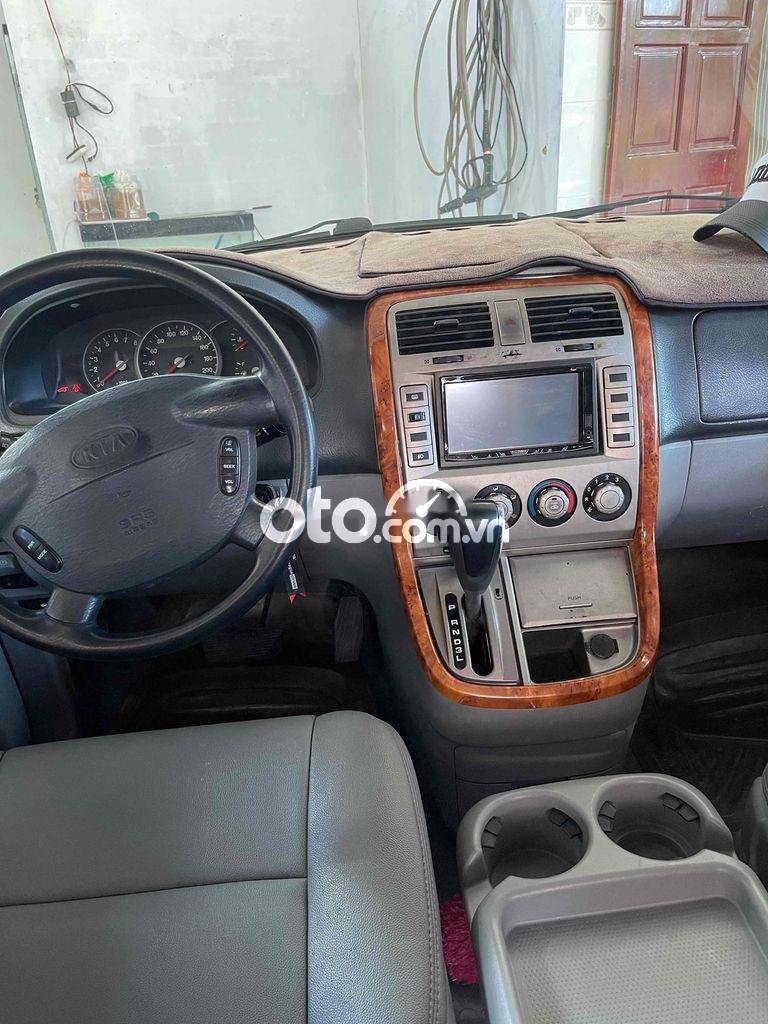 Kia Carnival 2009 - Cần bán lại xe Kia Carnival năm sản xuất 2009, màu đen