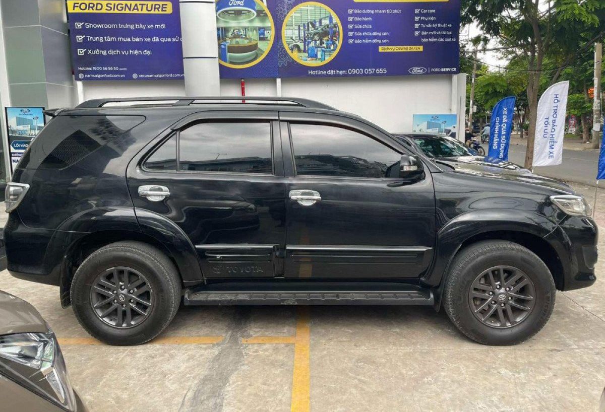 Toyota Fortuner 2014 - Xe Toyota Fortuner 2.7V 4x4 năm 2014, màu đen xe gia đình