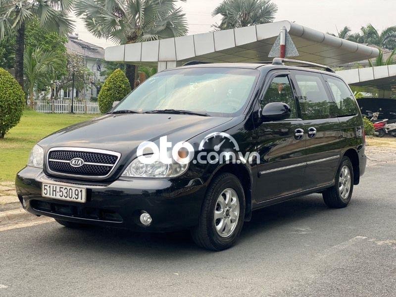 Kia Carnival 2009 - Bán Kia Carnival 2.5AT năm 2009, màu đen số tự động