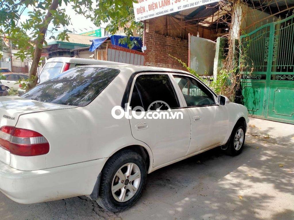 Toyota Corolla 1998 - Bán Toyota Corolla MT sản xuất năm 1998, màu kem (be), giá tốt