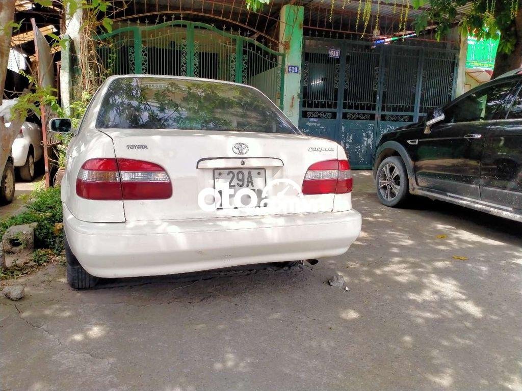 Toyota Corolla 1998 - Bán Toyota Corolla MT sản xuất năm 1998, màu kem (be), giá tốt