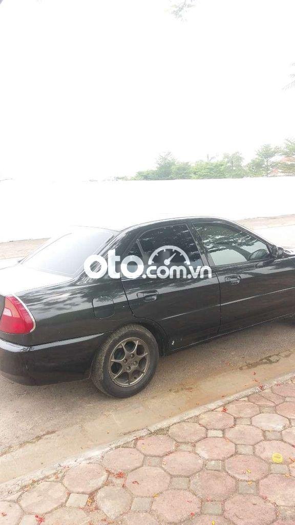 Mitsubishi Lancer 2002 - Bán Mitsubishi Lancer sản xuất năm 2002, màu đen, xe nhập, giá 85tr