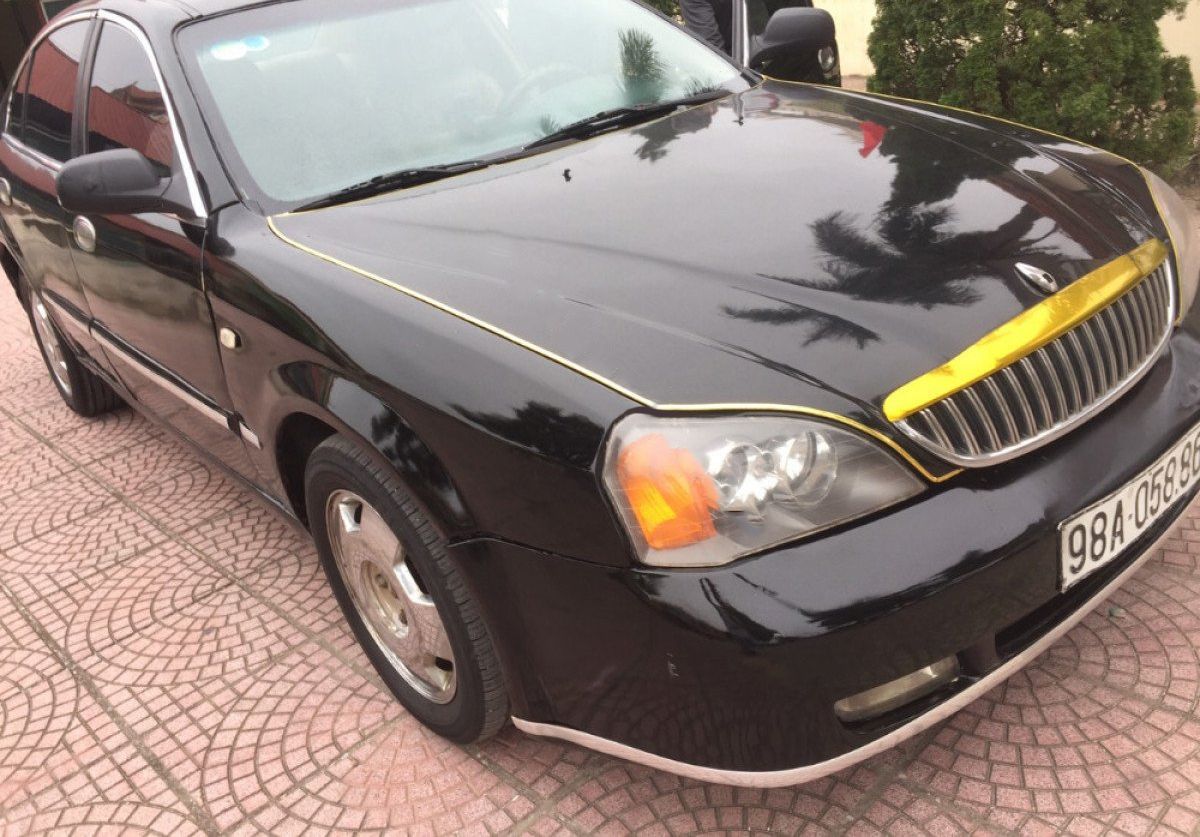 Daewoo Magnus 2004 - Bán ô tô Daewoo Magnus sản xuất năm 2004, màu đen 