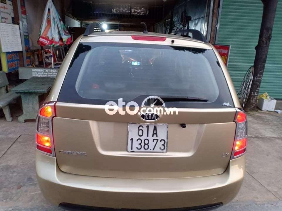 Kia Carens 2010 - Cần bán Kia Carens năm sản xuất 2010, màu vàng