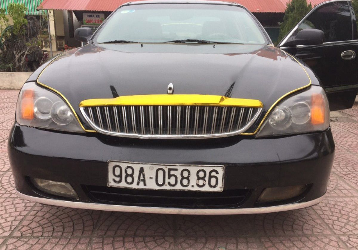 Daewoo Magnus 2004 - Bán ô tô Daewoo Magnus sản xuất năm 2004, màu đen 