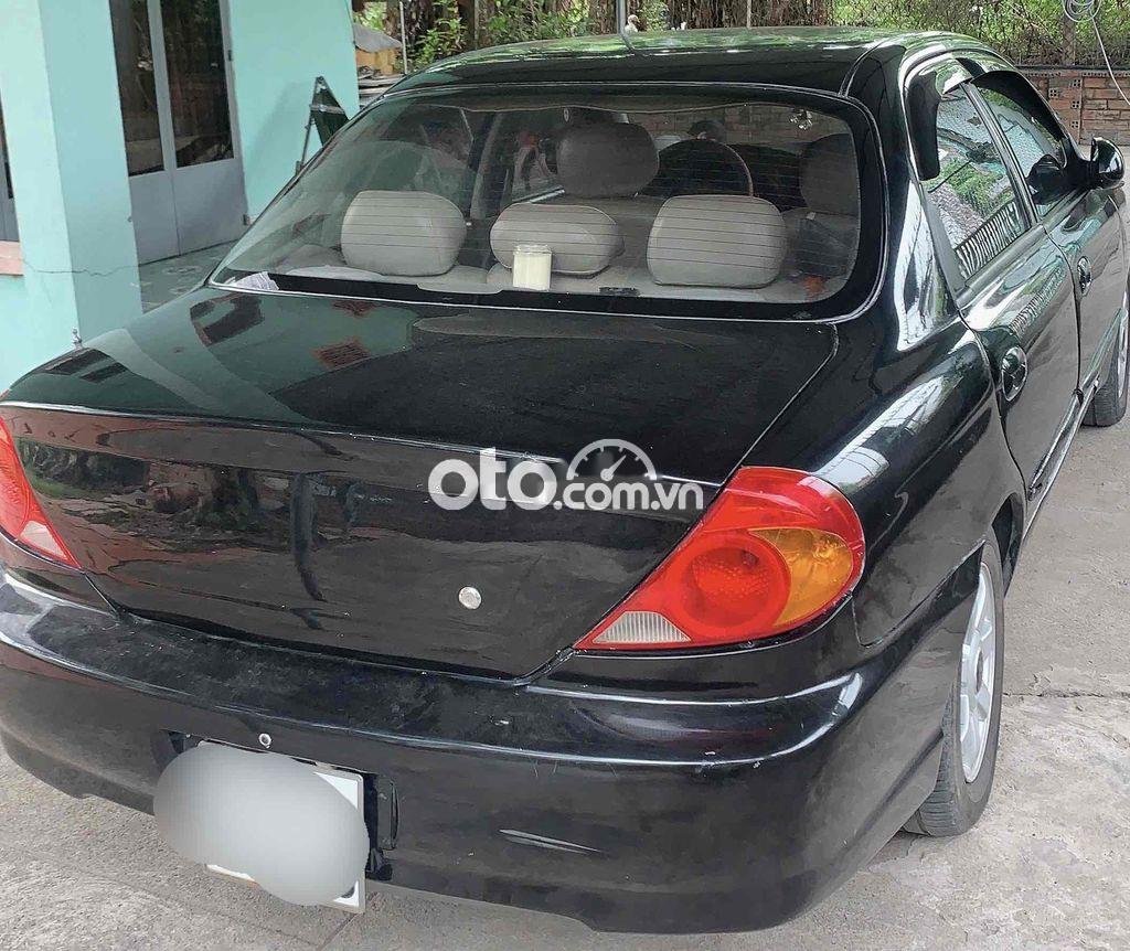 Kia Spectra 2004 - Cần bán gấp Kia Spectra năm sản xuất 2004, màu đen, nhập khẩu, giá 82tr